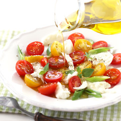 Tomato and Mozzarella salad with olive oil dressing