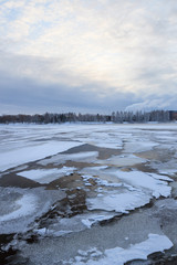 Thin ice on a lake at sunrise
