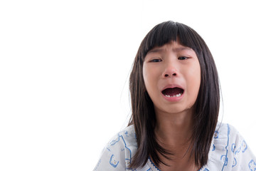 Close up Asian girl in pajamas crying on white.