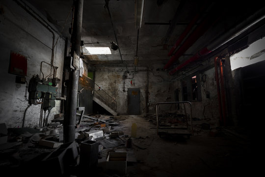 garbage, dirty room in an abandoned old factory workshop