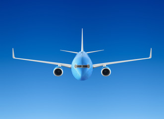 Fototapeta na wymiar Passenger airplane flying in the blue sky