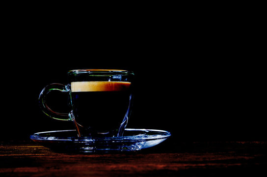 Glass Coffee Cup On The Table, Black Background