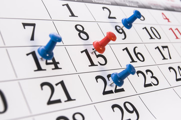 Closeup calendar page with drawing-pin
