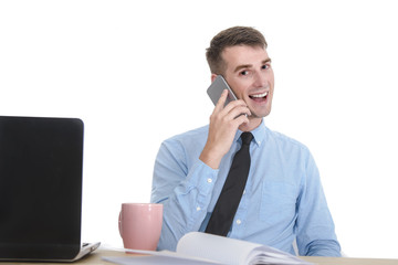 Young businessman working in office and talking mobile phone, is