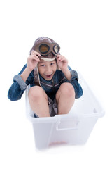 Asian boy playing with white box airplane with white background.