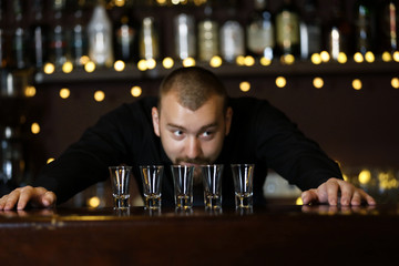 Portrait of handsome bartender at  work