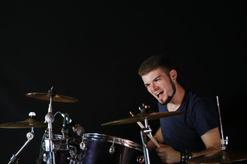 Drummer on dark background