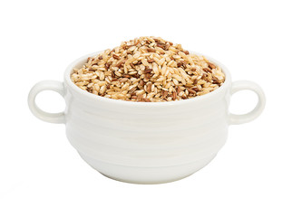 Raw brown rice in deep porcelain plate