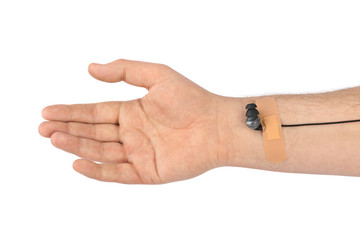 Hand with earphones like medical IV infusion