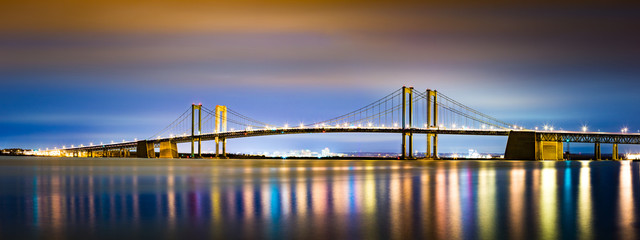 Delaware Memorial Bridge by night, viewed from New Jersey. The Delaware Memorial Bridge is a set of...