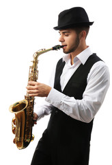 Fototapeta na wymiar Happy saxophonist plays music on sax in elegant suit on white background