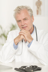 Portrait of mature doctor