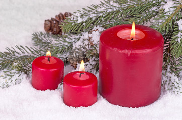 Three Burning Candles on Snow