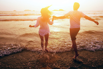 happy couple on the beach, summer vacations or honeymoon