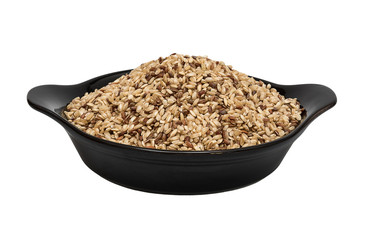 Raw brown rice in deep porcelain plate