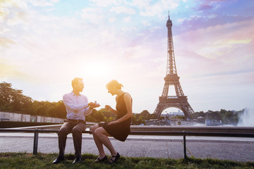 Fototapeta na wymiar marry me, proposal at Eiffel Tower in Paris, beautiful silhouettes of young caucasian couple
