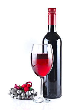 Red wine with Christmas ornament isolated on white background, s