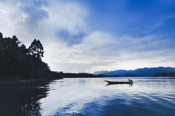 beautiful panoramic view of lake with boat of fisherman