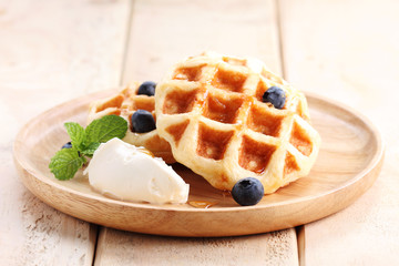 homemade belgian waffles with blueberries.