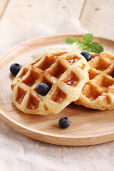 homemade belgian waffles with blueberries.