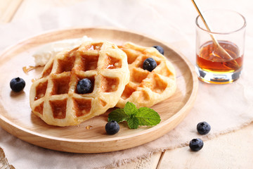 homemade belgian waffles with blueberries.