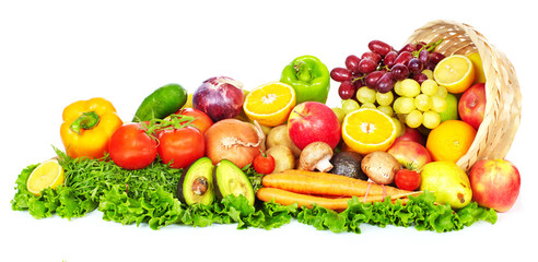 Fruits and vegetables over green background.
