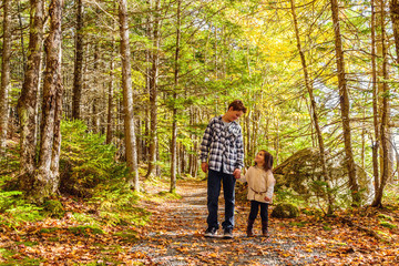 Fototapeta premium Brother and sister walking along park trail together