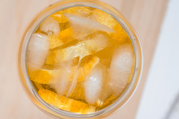 Wineglass of white sangria with lemon closeup