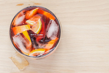 Sangria wine in the wineglass and pieces of ice