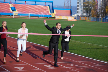 business people running on racing track