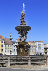 Fototapeta premium Fountain on the square in historic center of Ceske Budejovice.