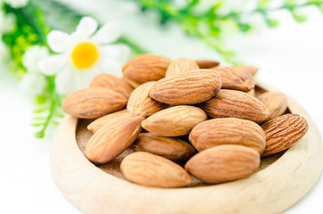 Almond in wooden dish.