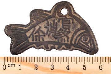 Antique China. Taoist monastery copper coin. Isolated on white © sytilin