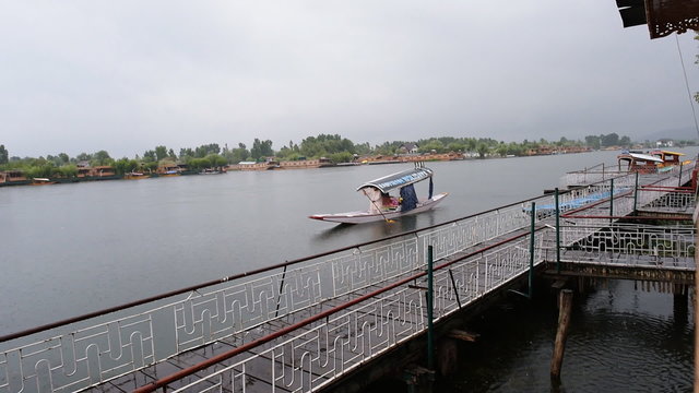 SRINAGAR, INDIA - JULY 12 2015: Boat around Dal Lake with rainy day, Srinagar, Jammu and Kashmir, India. 