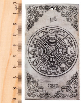 Ancient Tibetan amulet for good luck. Isolated on white