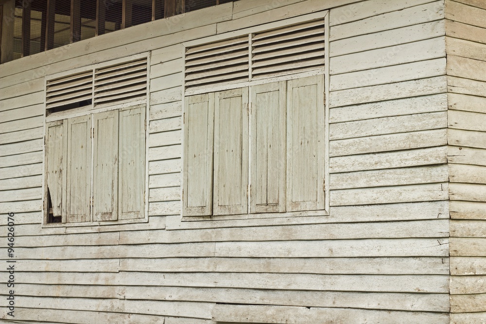 Wall mural the wood window texture on old wooden house
