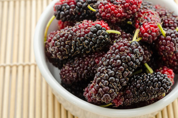 fresh organic mulberry in bowl.
