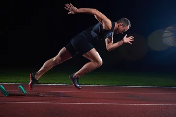 Zelfklevend Fotobehang Sprinter verlaat startblokken © .shock