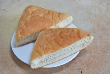 bread filling tuna on wooden chop block