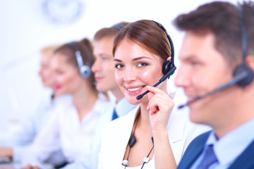 Attractive Smiling positive young businesspeople and colleagues in a call center office