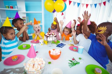 Excited kids enjoying a birthday party