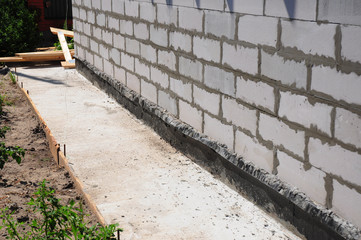 Close up Waterproofing Options for Concrete Foundations. Basement wall waterproofing.
