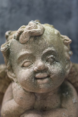 Fototapeta premium baby cupid,Sculpture at a Melbourne cemetery.