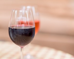 Red and rose wine glasses on a restaurant table
