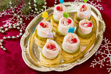 Appetizer canape with bacon and cucumber New Year's Eve