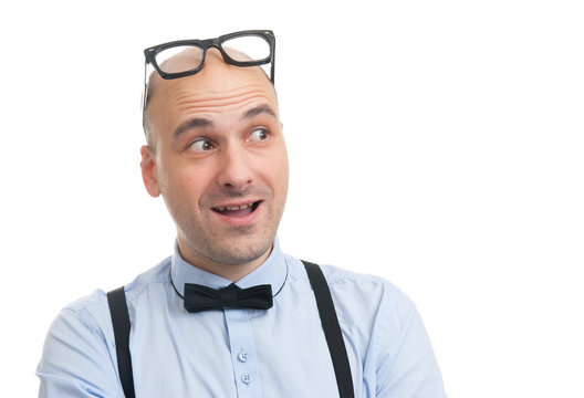 smiling man with suspenders and bow-tie