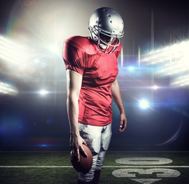 Composite image of american football player looking down