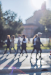 Blurred crowd of walking people in the city