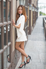 Portrait of young fashion model pretty women posing with vintage white colours tone concept