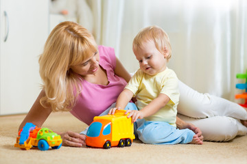 mother with child playng together at home